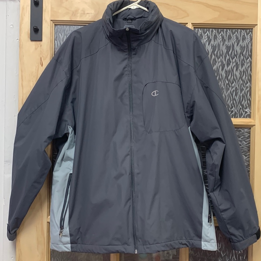 Champion jogging jacket with headphone/ phone pocket retractable hood